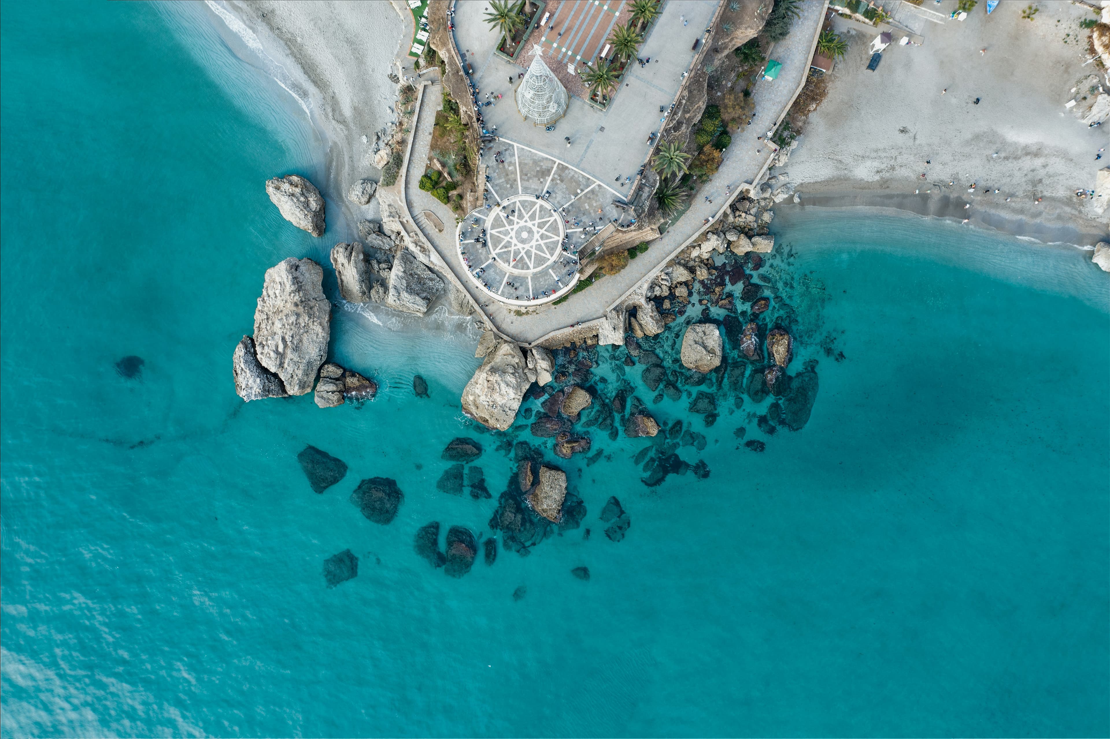 Aerial view of the Balcón de Europa viewpoint and beach in Nerja